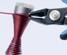 Cutting off the excess wire with cutters